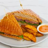 Pastrami Sandwich · pastrami, melted five cheese, lettuce, tomato, basil & utopia sauce on ciabatta