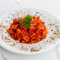 Housemade Manti · turkish dumplings stuffed with minced beef in a sauce of tomato paste, red pepper, mint, gar...