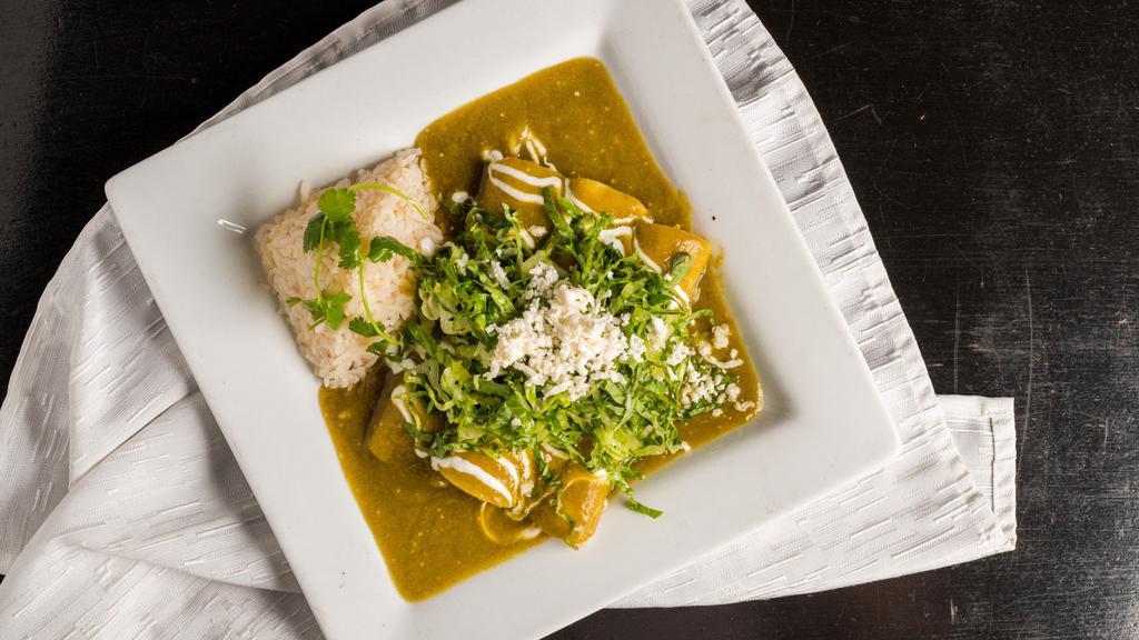 Enchilada Verdes · Three enchiladas stuffed with shredded chicken, grilled onions, roasted poblano peppers. With green tomatillo sauce.