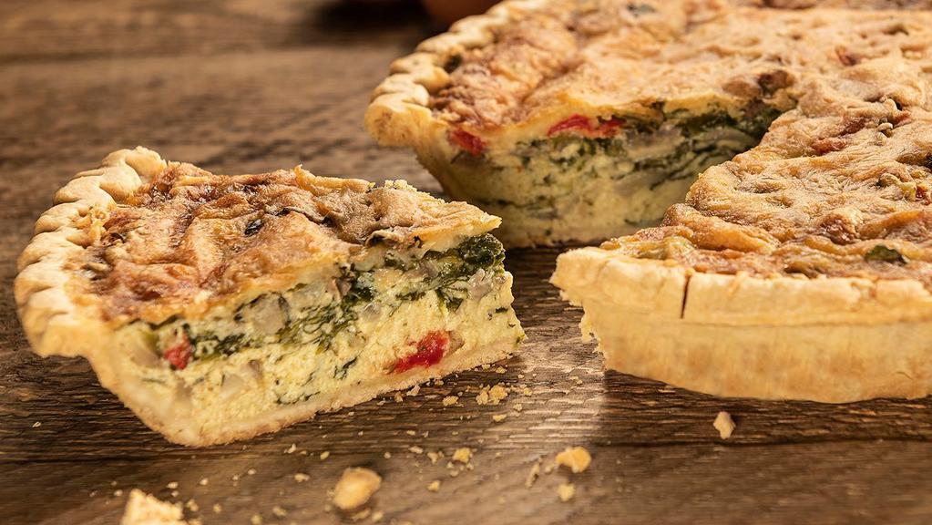 Quiche Florentine · Farm fresh eggs, jack and cheddar cheese, spinach, sliced mushrooms, onions and bell peppers baked in a flaky butter-crust - topped with a dollup of sour cream.