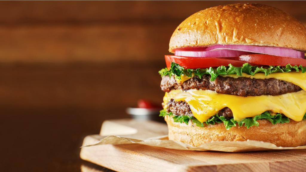 Cheeseburger · Two 1/4 pound sirloin patties grilled and seasoned and american cheese with your favorite toppings.