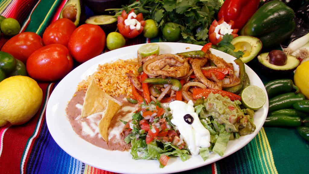 Fajitas (Combo) · Your choice of Steak, Shrimp, or Chicken Fajitas, with a salad, rice, beans and tortillas.