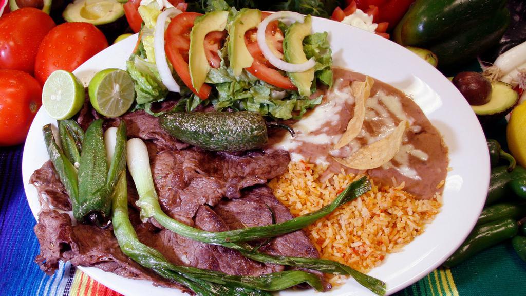Carne Asada (Combo) · Thinly sliced steak, with a side of rice, beans, salad and tortillas.