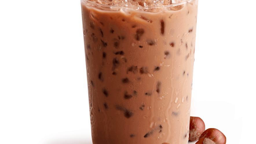 Iced Coffees|Hazelnut Iced Coffee · Our premium espresso shots blended with our specially developed hazelnut powder and served over ice for a refreshing and delicious hazelnut coffee drink.