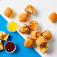 Bucket Of Rolls · A dozen soft potato rolls, buttered and lightly toasted, served with a choice of honey drizz...