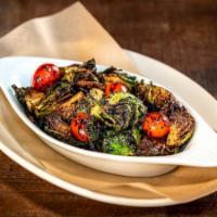 Sweet Smoky Brussels Sprouts · Balsamic reduction, smoked tomatoes