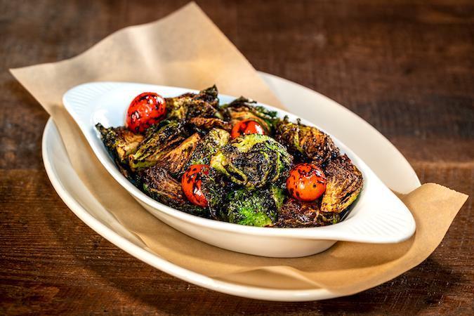Sweet Smoky Brussels Sprouts · Balsamic reduction, smoked tomatoes
