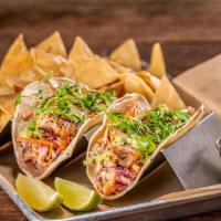 Slay Station Fish Tacos · Grilled fresh local Rockfish, jalapeño slaw, chipotle crema, aji verde, micro cilantro, corn...