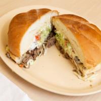 Torta · Grilled Mexican sandwich spread with mayonnaise, filled with beans, your choice of meat, let...