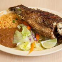 Mojarra Frita · Deep fried tilapia. come with rice fries and avocado slices. comes with rice beans and torti...