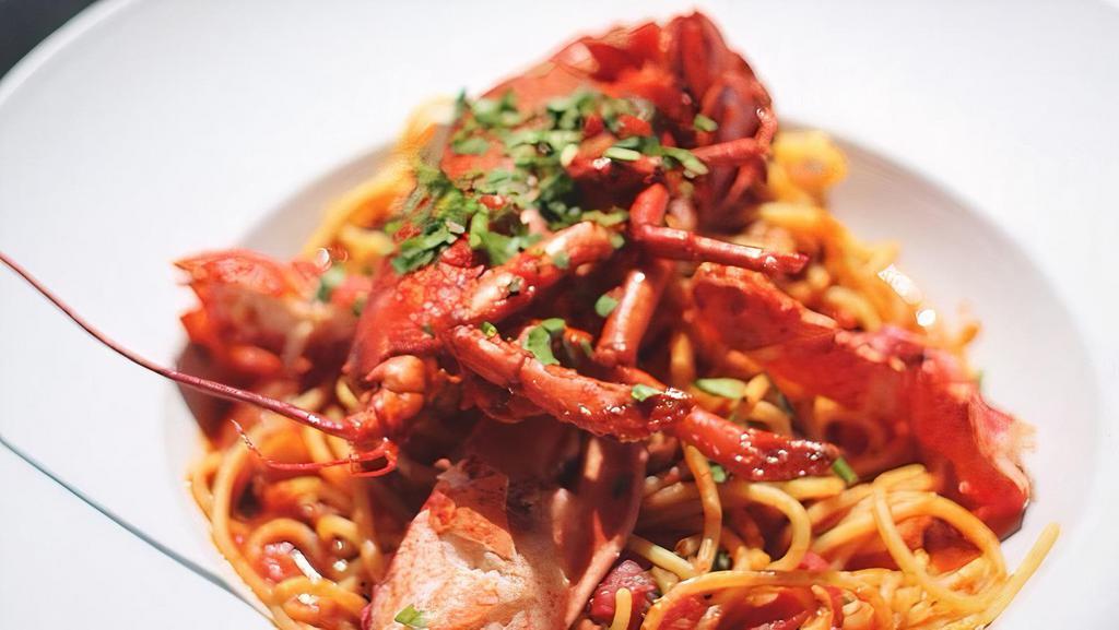Lobster Pasta · BUTTER POACHED LOBSTER TAIL, CLAW & KNUCKLES, GARLIC CONFIT, BASIL, POMODORO
