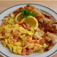 Lox, Eggs, & Onions · Our hand-slice nova salmon, delicately chopped, and scrambled with sautéed onions.