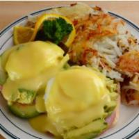Brent’S Special Benedict · Two poached eggs and Canadian Bacon on a grilled English Muffin topped with Avocado and Holl...