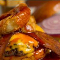 San Francisco Burger · Melted American cheese and two thick slices of bacon, topped with a heaping tower of crisp, ...