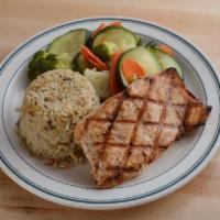 Grilled Salmon · An 8 oz. salmon fillet, grilled with garlic butter and served with rice pilaf and steamed ve...