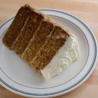 Four Layer Carrot Cake · Our spiced carrot cake with classic cream cheese frosting.