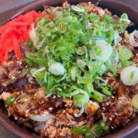 Chashu Pork Bowl · our homemade pork belly grilled and served over rice with green onions pickled ginger and a ...