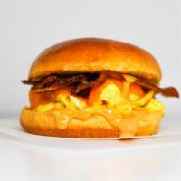 Bacon, Egg And Cheddar Brioche Sandwich · 2 fresh cracked cage-free scrambled eggs, melted Cheddar cheese, smokey bacon, and Sriracha ...