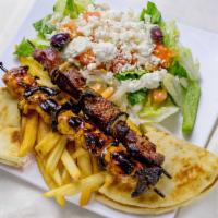 Chicken Kabob Plate · Two marinated skewers with onions and green peppers. Served with small Greek salad, a choice...