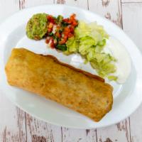 Chimichanga · Meat, rice, beans, and cheese. On the side sour ceam, guacamole, pico de gallo and lettuce.