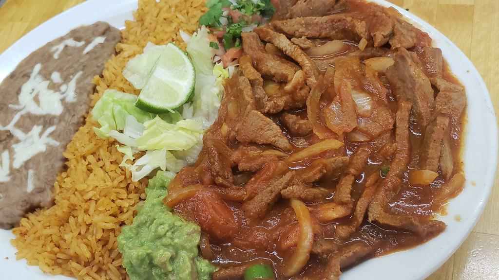 Steak Ranchero · Served with rice and beans. Also comes with flour or corn tortillas.