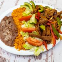 Beef Fajitas · Served with rice and beans . Also comes with flour or corn tortillas.