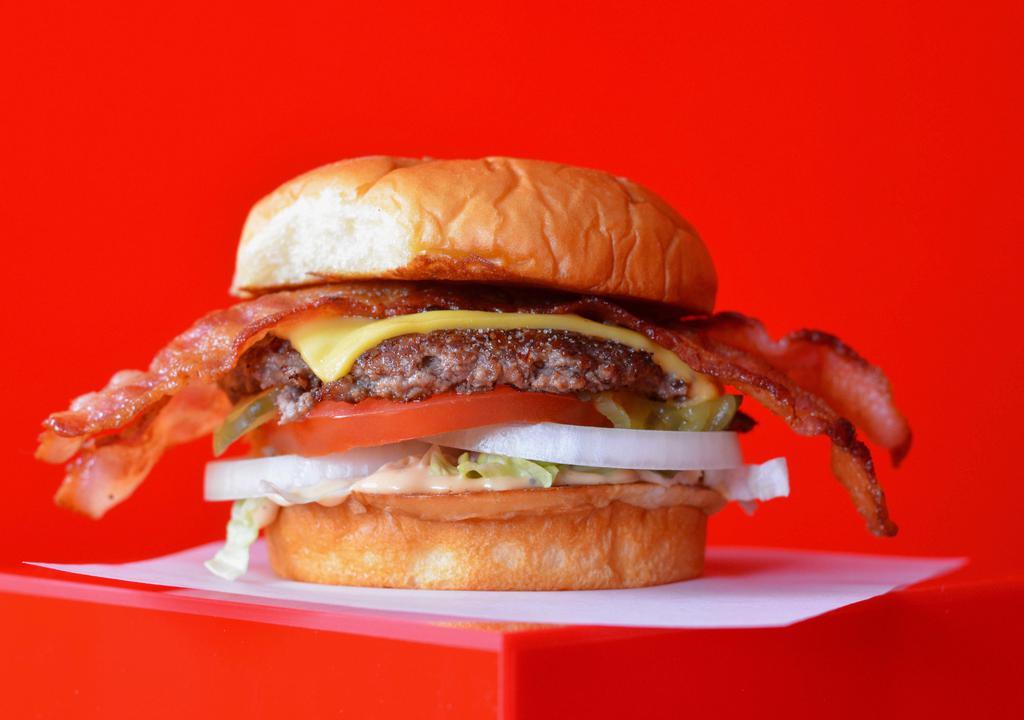 Bacon Super Smash Burger · Smash patty with smash sauce, American cheese, and bacon on a toasted potato bun.