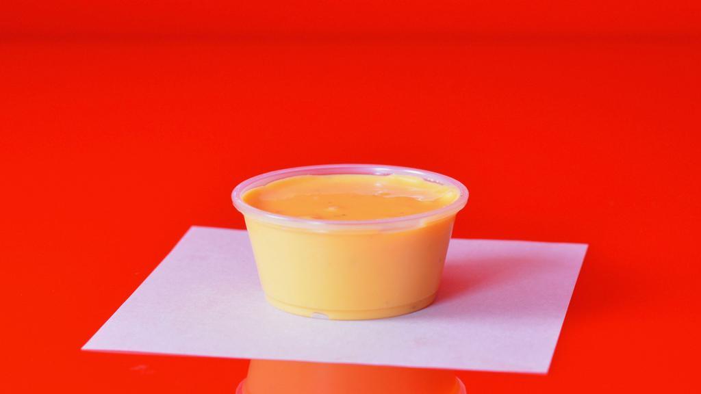 Side Of Melted Cheese Sauce · 