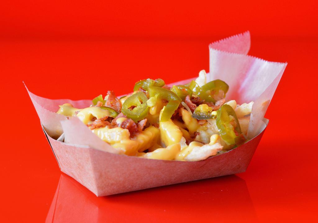 Jalapeno Bacon Cheese Fries · Our classic fries topped with melted cheddar cheese sauce, smoked bacon, and jalapenos