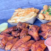 Wing Combo (20) · 20 chicken wings in up to two of our flavors, served with two sauces, two sides, and two dri...