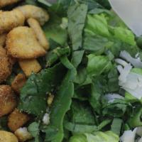 Caesar Salad · Crispy Romaine, fresh parmesan cheese and croutons, topped with Caesar dressing