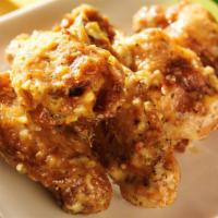 Garlic Parmesan Chicken Wings · Perfectly fried chicken wings in a garlic parmesan seasoning. Choose your size.