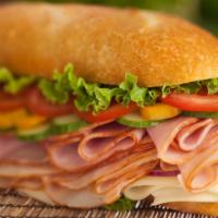 Turkey & Ham Club Sandwich · This sub has turkey and ham along with fresh lettuce, tomato, onion, bacon and avocado.