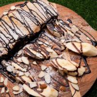 Nutella Wraps · spreaded nutella, topped with banana, sliced almond and white sugar