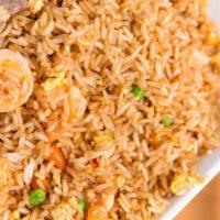 House Fried Rice · Shrimp, chicken and beef. Stir-fried with onions, eggs, peas and carrots.