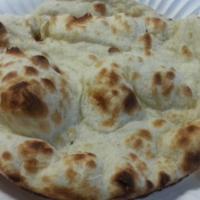 Plain Naan · Leavened bread baked in tandoor.