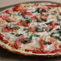Margherita Pizza · organic tomato sauce, mozzarella, cherry tomatoes, roasted garlic, fresh basil