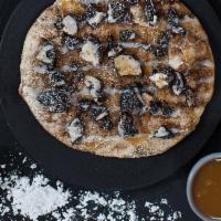 Dessert Pizza · homemade dough, melted butter, cinnamon, oreo crumbles, caramel and icing drizzle, powdered ...