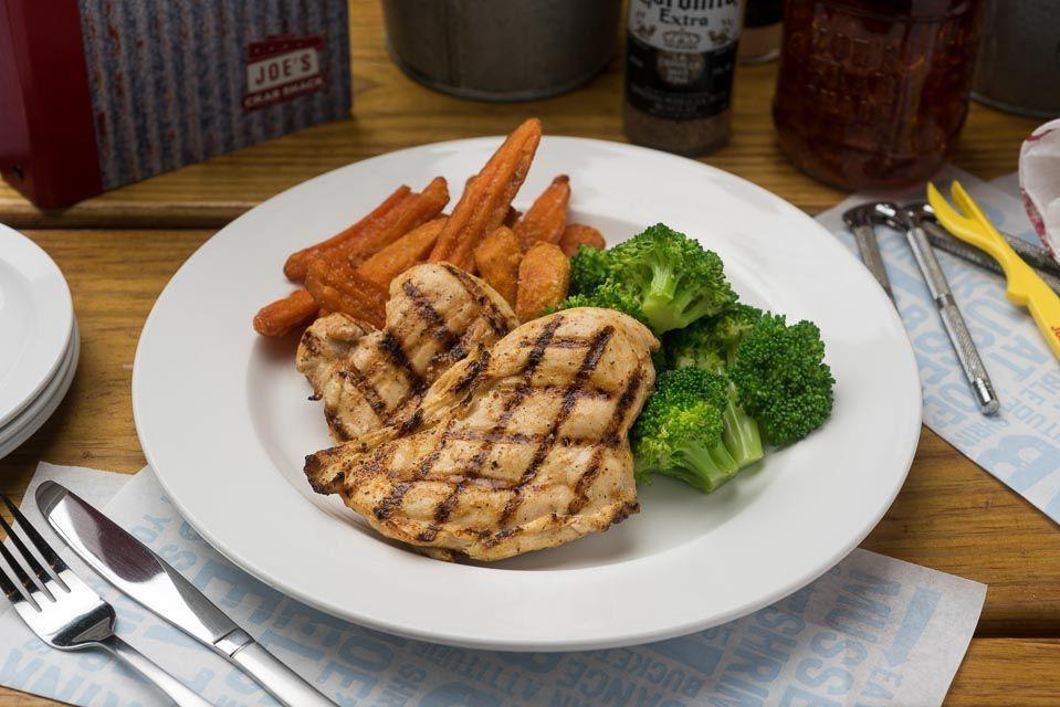 Herb Grilled Chicken Breast · Chicken breasts topped with herb butter. Served over mashed potatoes and seasonal vegetables. This item can be prepared gluten free.