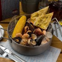 Steamer Steampot · Mussels, clams, shrimp, garlic seasoning, with garlic bread. This item can be prepared glute...