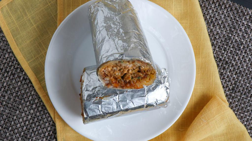 Super Burrito · With meat, rice, beans, salsa, guacamole, sour cream and cheese.