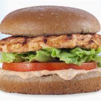 Grilled Chicken Sandwich · Grilled all white meat chicken, fresh lettuce and tomato and special dressing on a toasted w...