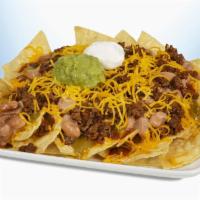 Nachos · Crispy tortilla chips covered with mild real cheddar cheese, mild red and spicy green sauce,...