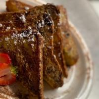 French Toast And Fruit · Four delicious slices of French toast served with seasonal fruit.
