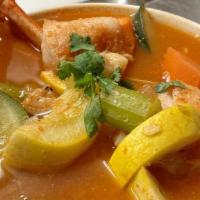 Seven Seas Soup/ Siete Mares · Soup with crab leg, fish, shrimp, and veggies.