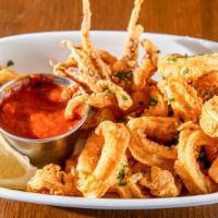 Calamari · Rings and tentacles dreged in our house flour blend flash fried and served with our robust h...