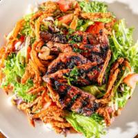 Marinated Steak Salad · Grilled to order prime beef steak with mixed greens, tomatoes. Toasted pumpkin seeds, chili ...