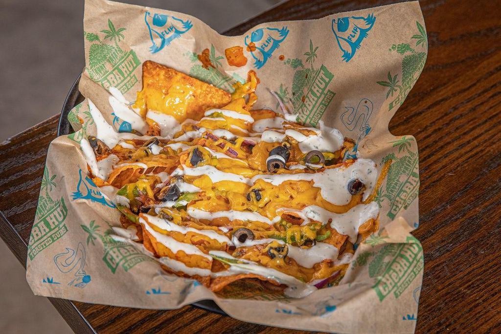 Loaded Not'Chos (Single) · Melted cheddar cheese, jalapenos, onion, black olives and hot sauce on a bed of Nacho Cheese Doritos (1 Bag) with Ranch drizzled on top.
