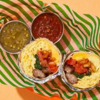 Comfy Tomato And Spinach Breakfast Burrito · Two scrambled eggs with delicious breakfast sausage, crispy home fries, melted cheese, tomat...