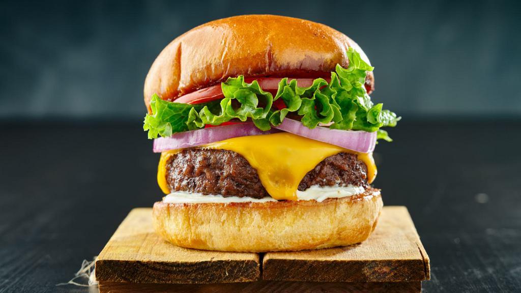 Cheeseburger · Mouthwatering Burger topped with cheese, lettuce, tomato, onion, and pickles.